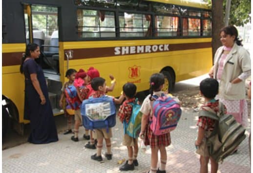Students in a bus of shemrock play school franchise
